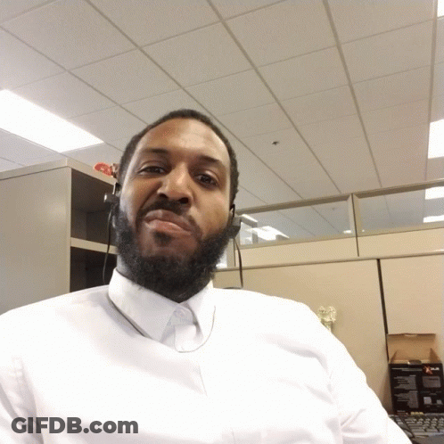 Bearded Man In White Shirt Looking Down GIF