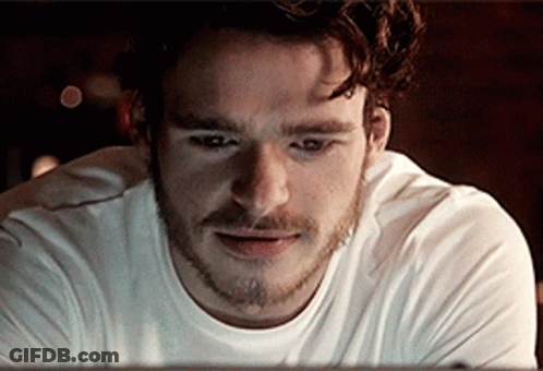 Bearded Man In White Shirt Looking GIF