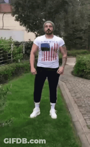 Bearded Man In White Shirt Saying America GIF