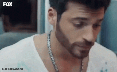 Bearded Man In White Shirt With Chain GIF