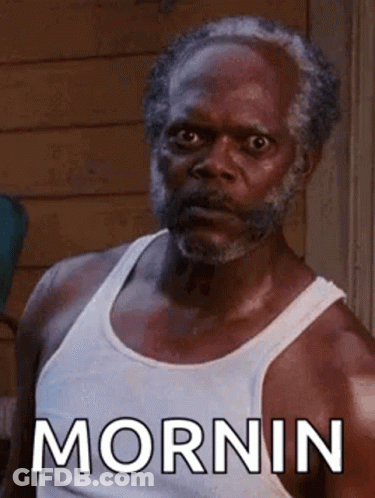 Bearded Man In White Tank Top Saying Morning GIF