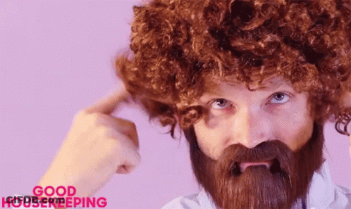 Bearded Man In Wig Making Funny Face GIF