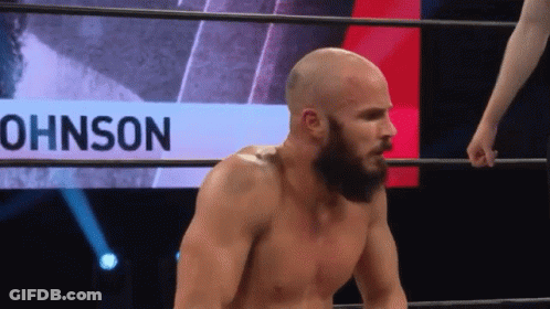 Bearded Man In Wrestling Ring With Johnson Behind Him GIF