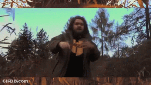 Bearded Man In Wu Tang Shirt In Woods GIF