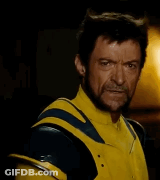 Bearded Man In Yellow Blue Superhero Costume GIF