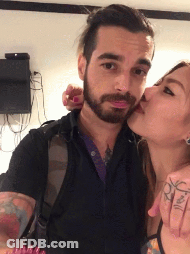 Bearded Man Kissing Woman GIF