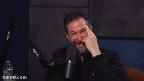 Bearded Man Laughing At Rode Microphone GIF