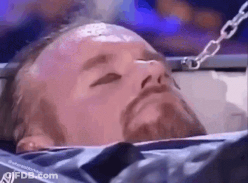 Bearded Man Laying In Cage Eyes Closed GIF