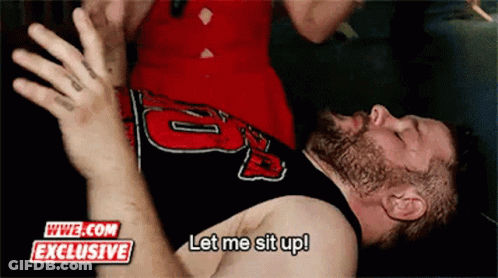 Bearded Man Laying On Ground Let Me Sit Up GIF