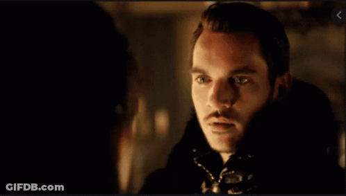 Bearded Man Looking At Another Man In Dark Room GIF