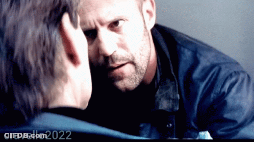 Bearded Man Looking At Another Man's Face 2022 GIF