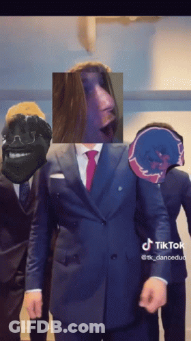 Bearded Man Looking At Camera In Car With Others GIF