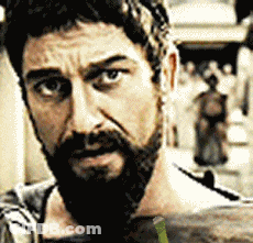 Bearded Man Looking At Camera With Crowd GIF