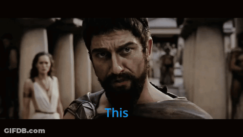 Bearded Man Looking At Camera With This In Blue GIF