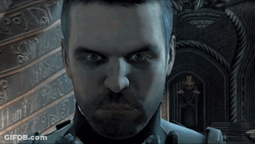 Bearded Man Looking At Camera With X On Wall GIF