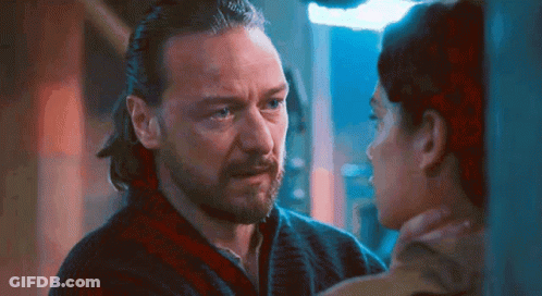 Bearded Man Looking At Woman With Ponytail GIF