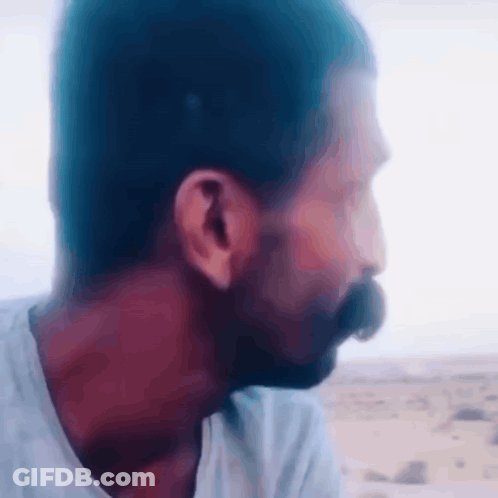 Bearded Man Looking Into Distance GIF