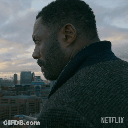 Bearded Man Looking Over City With Netflix Logo GIF