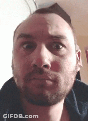 Bearded Man Looking Seriously At Camera GIF