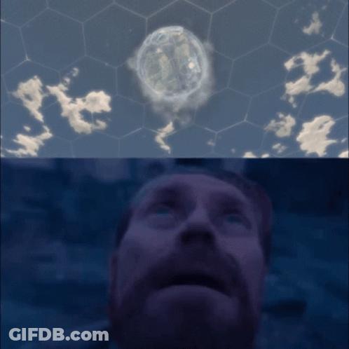 Bearded Man Looking Up At Sphere In Sky GIF