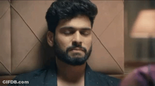 Bearded Man Lying Down Eyes Closed GIF