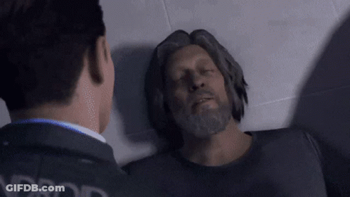 Bearded Man Lying On Floor With Eyes Closed Another Man Watching GIF