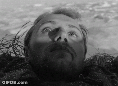 Bearded Man Lying On Ground Looking Up GIF