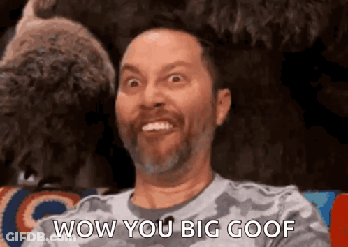 Bearded Man Making Funny Face At Stuffed Animal GIF