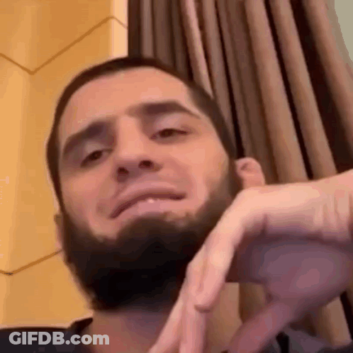 Bearded Man Making Funny Face By Window GIF