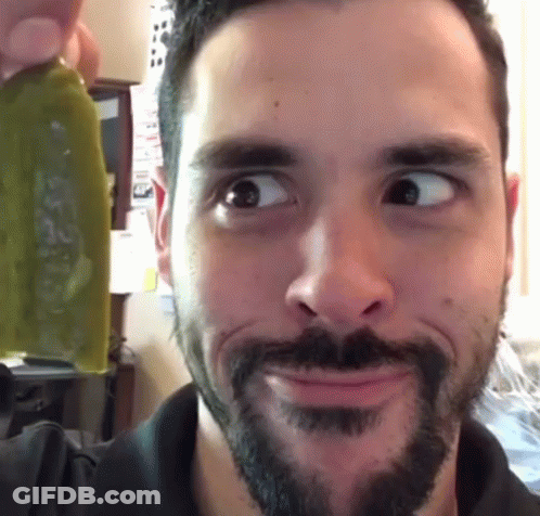 Bearded Man Making Funny Face Holding Green Object GIF