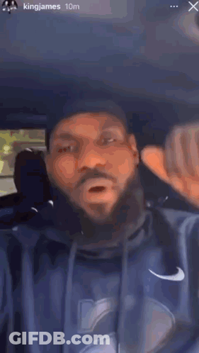 Bearded Man Making Funny Face In Back Seat GIF
