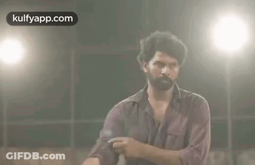 Bearded Man Making Funny Face In Front Of Light GIF