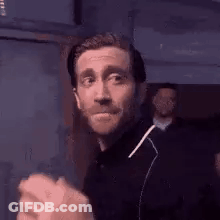 Bearded Man Making Funny Face While Dancing GIF
