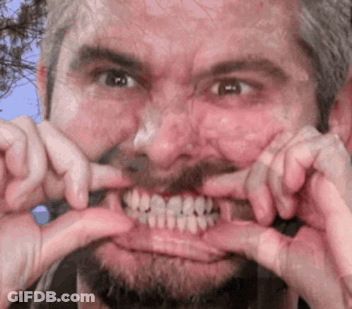 Bearded Man Making Funny Face With Mouth Open GIF
