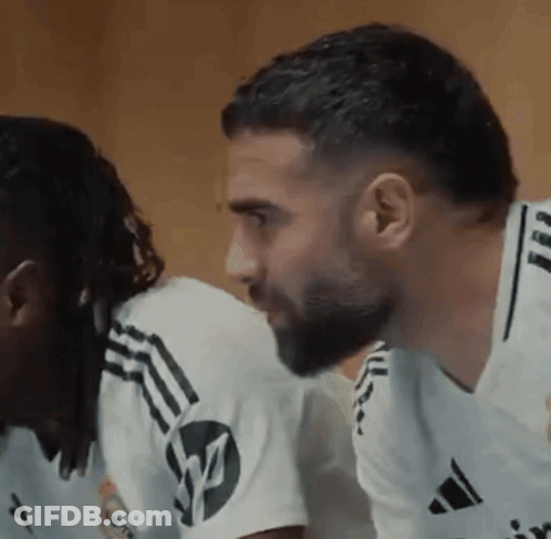 Bearded Man Next To Man In White Adidas Shirt GIF