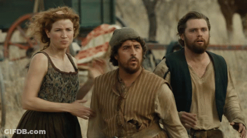 Bearded Man Next To Red Haired Woman GIF