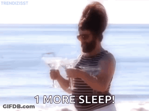 Bearded Man On Beach Holding Martini And Newspaper GIF