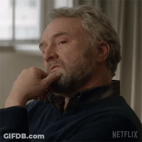 Bearded Man On Couch Hand On Chin Netflix Logo GIF