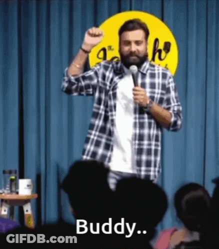 Bearded Man On Stage Holding Microphone GIF