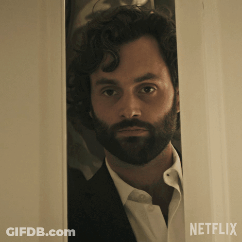 Bearded Man Peeking Behind Netflix Door GIF