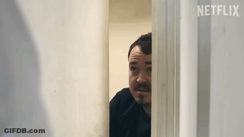 Bearded Man Peeking Through Door GIF