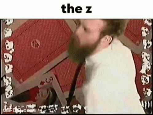 Bearded Man Playing Cards With Card Saying The Z GIF