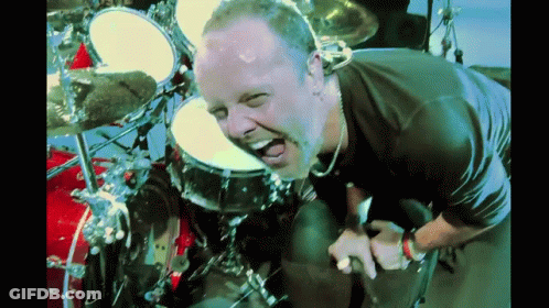 Bearded Man Playing Drums Making Funny Face GIF