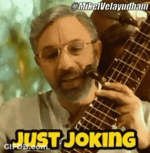 Bearded Man Playing Guitar Saying Just Joking GIF