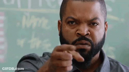 Bearded Man Pointing At Camera By Chalkboard GIF