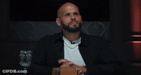 Bearded Man Pointing In Chair GIF