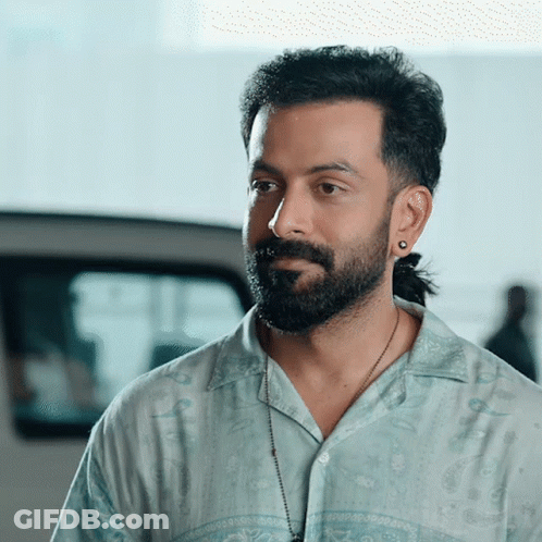 Bearded Man Ponytail Blue Shirt GIF