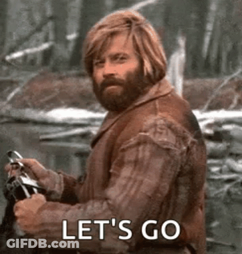Bearded Man Riding Motorcycle In Woods GIF