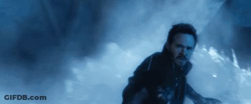 Bearded Man Running In Dark Room GIF