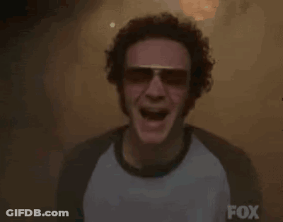 Bearded Man Running Through Fire In People Shirt GIF